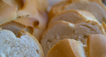 Fresh bread slice. Lots of fresh bread and slices closeup. Sliced homemade bread.