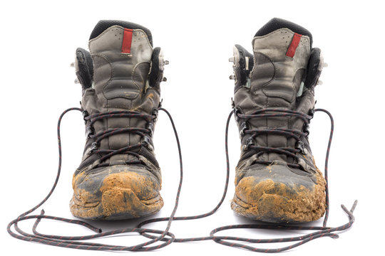 Hiking Dirty Boots Isolated On White Background