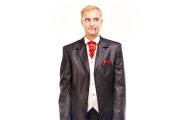 Portrait of handsome young vampire against white background