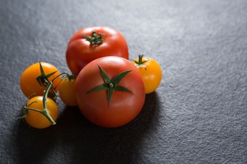 Tomatoes on black background