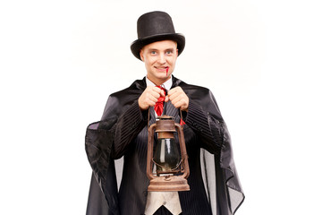 Portrait of handsome young vampire against white background