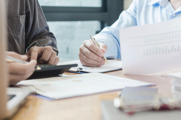 Business team hands at work with financial reports