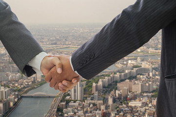 Businessman handshake,businessman shaking hands to seal a deal with his partner	