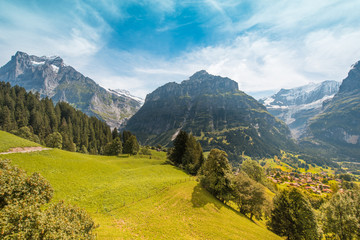 Fototapeta na wymiar Fantastic scenery from a height on Grindelwald valley in Swiss Alps near Eiger, Switzerland, Europe.