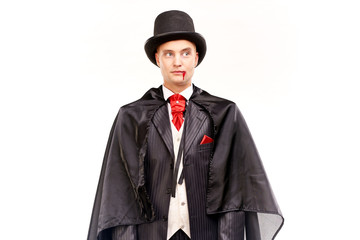 Portrait of handsome young vampire against white background