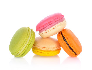 French colorful macarons isolated on a white background