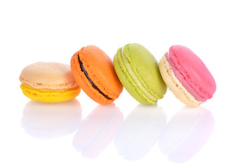 French colorful macarons isolated on a white background