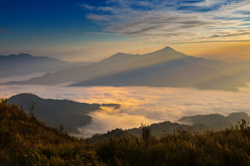 morning mountain view with sunbeam and haze at Doi Pha Tang, chiang rai, thailand