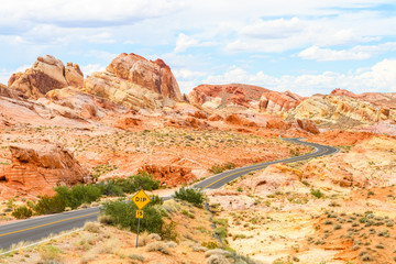 sinuous road crossing valley of fire desert, nevada