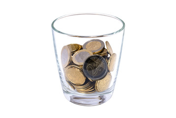 Glass with coins on white background: concept of financial savings