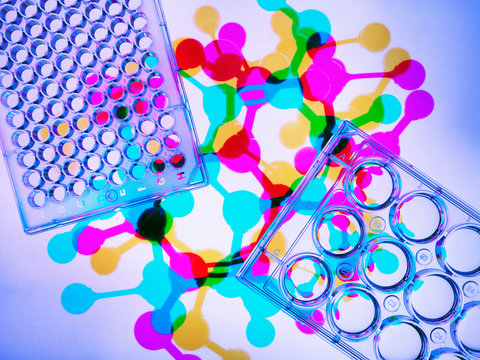 Photogram. Multiwell plates containing samples, molecular model of drug formula in background to illustrate ground breaking pharmaceutical research
