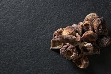 Dried dates on black background