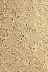 Background of a beige color for a New Year's card. The paint texture is painted with a brush on the paper.