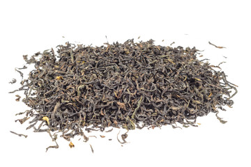 Dry black tea leaves isolated on white