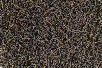 Close-up of black tea dry leaves. texture