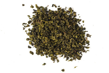 Dry black tea leaves isolated on white