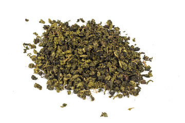 Dry black tea leaves isolated on white