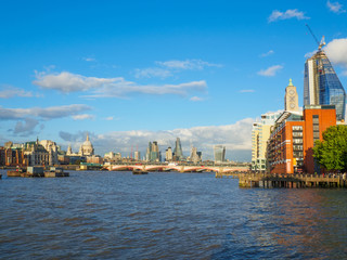 Fototapeta premium London skyline with a view of St Paul's Cathedral, Blackfriars Bridge and skyscrapers of the City on a sunny afternoon.