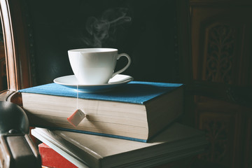 Book and tea on the desk with study