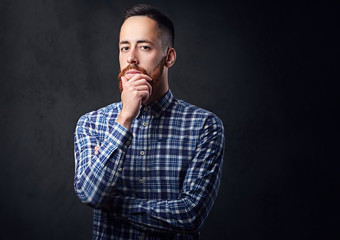 A man with crossed arms, dressed in a blue fleece shirt.