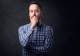 A man with crossed arms, dressed in a blue fleece shirt.