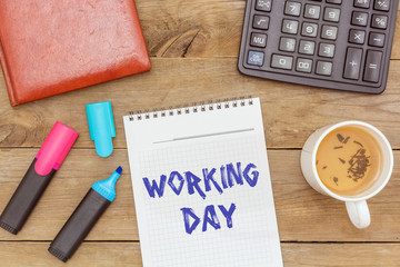 flat lay: green tea and writing in a notebook