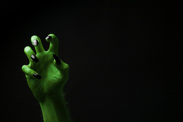 Halloween green witches or zombie monster hand