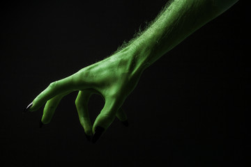 Halloween green witches or zombie monster hand © ink drop