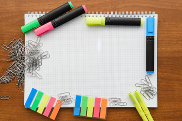 Top view on a white sheet lined up with a stationery