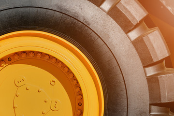 Part of the wheel of a large heavy dump truck for working on a coal mine