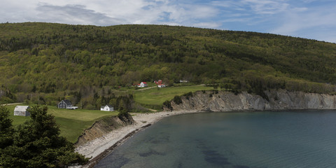 Fototapeta na wymiar Scenic view of village at coastline, Cape North, Cape Breton Island, Nova Scotia, Canada