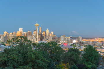Seattle downtown skylines, urban office buildings with Mt Rainier at blue hour as seen from Kerry...