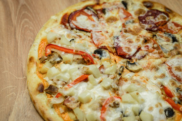 Fresh tasty pizza Margarita on wooden background