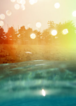 sea and sun flare blurred background