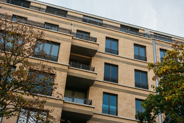 Fototapeta premium detailed view of orange apartment building
