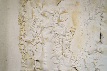 Old cracked paint on the concrete wall