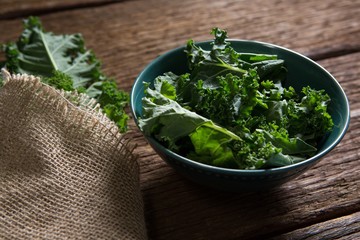 Mustard greens on wooden table