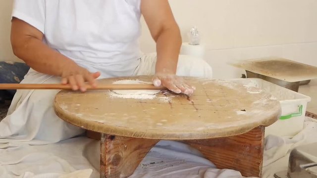 Woman preparing a traditional Turkish tortilla