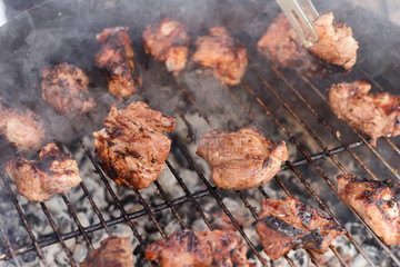 Barbecued pork on stick on charcoal grill