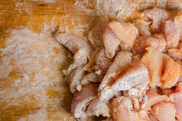 Raw chicken breasts on cutting board