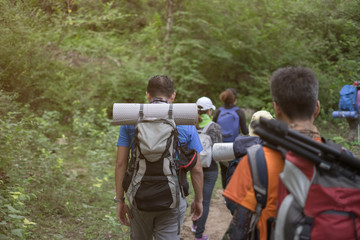 Group tourists hiking on sunny days. subject is blurred.