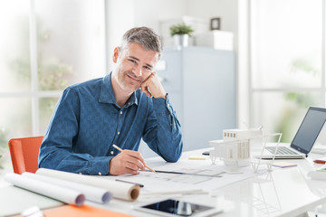 Professional architect in his office