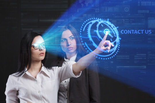 The concept of business, technology, the Internet and the network. A team of business women working on the virtual screen of the future and see the inscription: Contact us