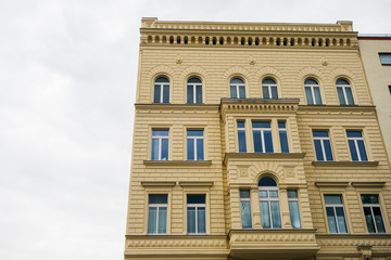 yellow real estate house on cloudy day