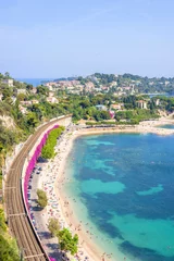 Wall murals Villefranche-sur-Mer, French Riviera Beautiful daylight view from top of mountains to luxury resort villefranche sur mer and bay on french riviera at mediterranean sea Cote d'Azur in France. Railways and beach with people