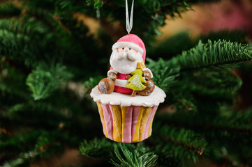 Christmas tree toy in a form of cupcake