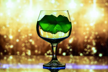 glass with artificial ice on an abstract background