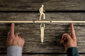 Two people using their hands to hold up blocks