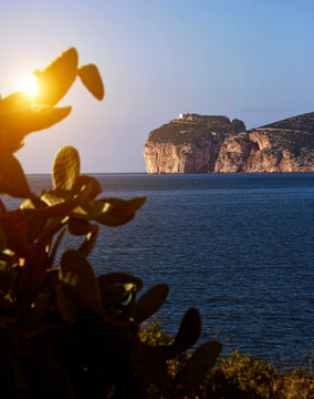 Scenic coastal view with cliff top lighthouse, Capo Caccia, Alghero, Sardinia, Italy