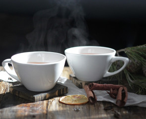 Christmas white cup of hot tea and spices